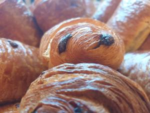 a pile of croissants sitting on top of each other at Hôtel Restaurant Aux Deux Roses in Neuf-Brisach