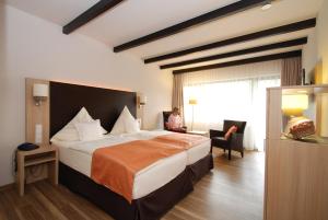 Postel nebo postele na pokoji v ubytování Hotel Steuer