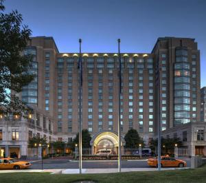 a large building with cars parked in front of it at Hyatt Regency Reston in Reston