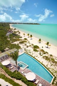 an aerial view of a beach with a swimming pool at The Shore Club Turks & Caicos in Grace Bay