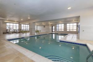 a large swimming pool in a large building with a pool at Hampton Inn Rock Springs in Rock Springs