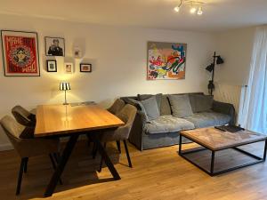 a living room with a couch and a table at Seepferdchen in Timmendorfer Strand