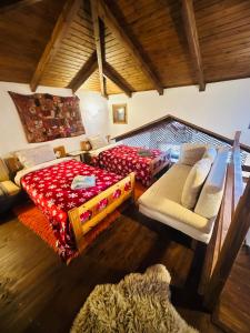 a living room with a couch and a bed at CHALET MARIA livadi in Arachova