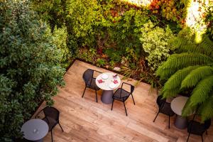 an overhead view of a table and chairs in a garden at Hotel Villa Koegui Biarritz in Biarritz