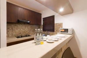 Kuchyň nebo kuchyňský kout v ubytování Vidi Boutique Hotel