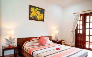 a bedroom with two beds and a window at Britannia Hotel in Grand'Anse Praslin +98 photos