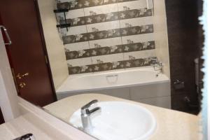 a bathroom with a sink and a bath tub at imperial homes 2 in Ajman  +22 photos