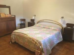A bed or beds in a room at Podere Telesforo