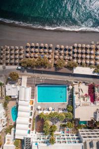 an aerial view of a resort with a swimming pool at Kamari Beach Hotel in Kamari