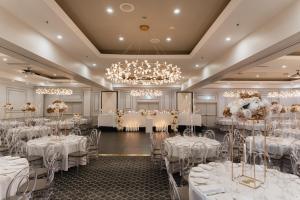 a ballroom with tables set up for a wedding at Visy Dior in Baulkham Hills +55 photos