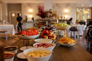 a table topped with bowls of fruit and other food at Visy Dior in Baulkham Hills