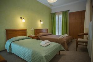 Postel nebo postele na pokoji v ubytování Hotel Liberty