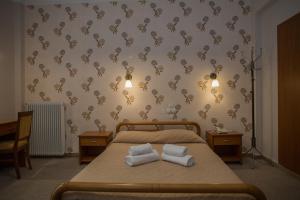 Postel nebo postele na pokoji v ubytování Hotel Liberty
