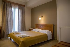 Postel nebo postele na pokoji v ubytování Hotel Liberty