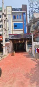 a red brick walkway in front of a building at HOTEL classic in Visakhapatnam