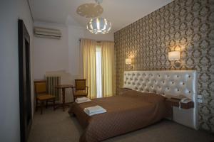 Postel nebo postele na pokoji v ubytování Hotel Liberty