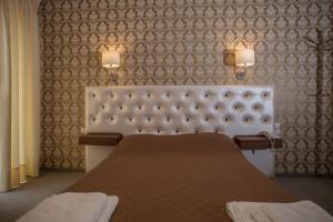 Postel nebo postele na pokoji v ubytování Hotel Liberty