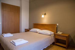 Postel nebo postele na pokoji v ubytování Hotel Liberty