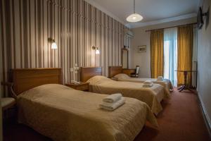 Postel nebo postele na pokoji v ubytování Hotel Liberty