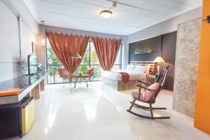 a bedroom with a bed and a living room at T Vintage in Bang Khla
