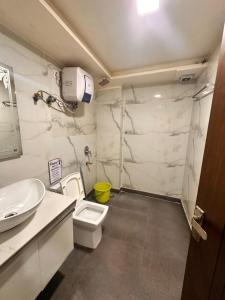 a bathroom with a toilet and a sink at Taj Castle Homestay in Agra +51 photos
