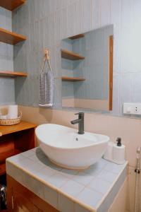 a white sink on a counter in a bathroom at Katig Beachfront Boutique Hotel in General Luna +37 photos