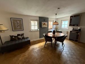 a living room with a table and a couch at Appartement Rothenburg in Rothenburg ob der Tauber