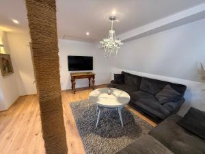 a living room with a couch and a table at Appartement Rothenburg in Rothenburg ob der Tauber