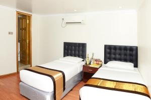 Katil atau katil-katil dalam bilik di Hotel Bond