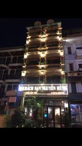 a building with a sign on the front of it at Khách Sạn Nguyễn Hùng in Sapa