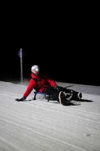 a person is laying down in the snow at Apartment Prinzip Hoffnung in Bürs