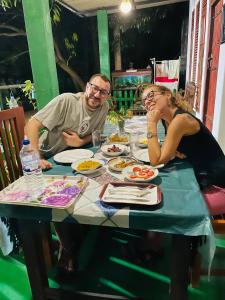 a man and woman sitting at a table with food at Jm Resort in Dambulla +191 photos