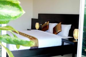 Postel nebo postele na pokoji v ubytování The Oasis Khaolak Resort - SHA Plus + 32 fotografií