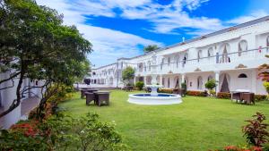 a courtyard of a building with a fountain at Boracay Summer Palace Hotel in Boracay