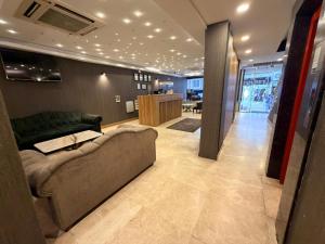 a living room with a couch and a table at Rain Golden Hotel in Istanbul