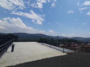 a large patio with a view of the mountains at Venus Valley Vagamon in Vagamon