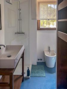 a bathroom with a sink and a tub and a toilet at Villa Velta Calagrande in Porto Santo Stefano +45 photos
