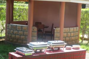 a table with three stoves on top of it at Paran Amboseli Resort in Kimana +27 photos