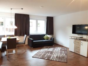 A seating area at Alpen-Appartements Zürcher