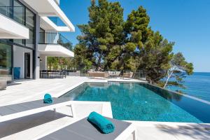 an image of a swimming pool in a house at Luxury Seafront Villa Miracul Korcula with Pool in Blato