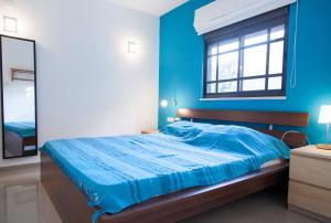 Ένα ή περισσότερα κρεβάτια σε δωμάτιο στο Carmel Home Mount Seaview