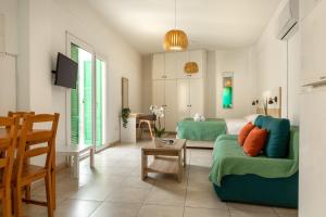 a living room with a couch and a table at 4YOU STUDIOS in Larnaca