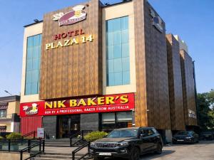 a car parked in front of a hotel plaza at Hotel Plaza 14 Jammu, Near Railway Station in Jammu