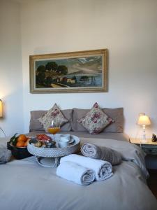 a bed with a tray of food on top of it at como villa il panorama in Como