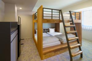 a bunk bed with a ladder in a room at WAYPOINT TSUKIJI Tokyo in Tokyo