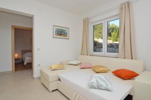 Postel nebo postele na pokoji v ubytování Apartments Surjan