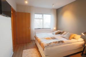 Postel nebo postele na pokoji v ubytování V54 Harbour Apartments