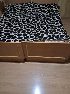 a bed with a black and white mattress at Hotel kazbegi1 in Ach'khoti