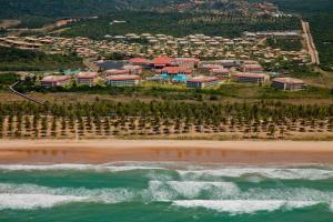 an aerial view of a beach with a resort at Grand Palladium Imbassaí Resort & Spa - All Inclusive in Imbassai