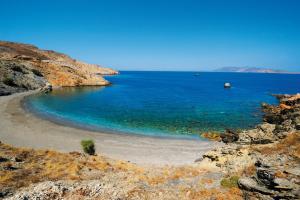 a small beach in the middle of the ocean at Vardia Bay Studios in Karavostasi
